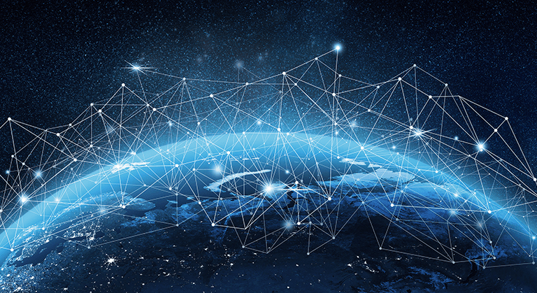 A view of Earth from space with a glowing network of interconnected points and lines overlaying the planet, symbolizing global digital connectivity and communication.