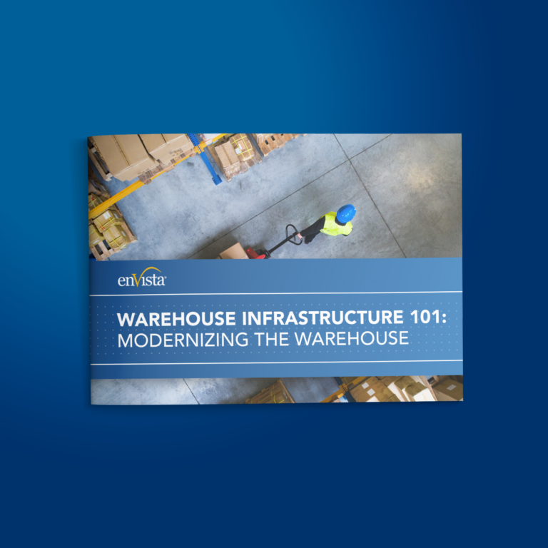 A brochure cover titled Warehouse Infrastructure 101: Modernizing the Warehouse shows an aerial view of a worker in a safety vest and helmet moving boxes with a pallet jack in a warehouse.