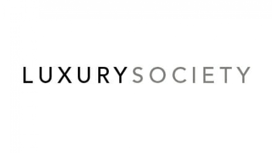 The image displays the words LUXURY SOCIETY in capital letters. LUXURY is in bold black font, while SOCIETY is in a lighter gray font on a white background.