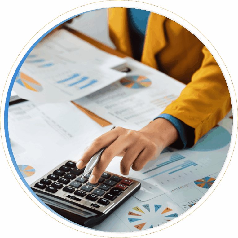 A person in a yellow jacket using a calculator, surrounded by financial charts, graphs, and documents on a desk—analyzing data with the help of Dynamics 365 Finance for smarter decision-making.