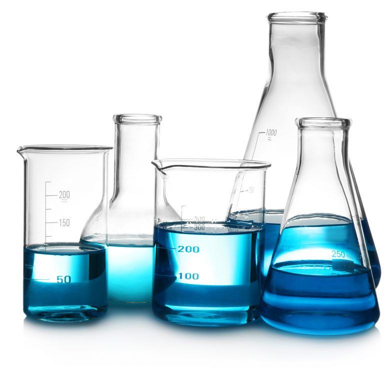 A group of laboratory glassware, including beakers and flasks, filled with blue liquid, is arranged on a white background—capturing precision much like d365 sales streamlines business processes.