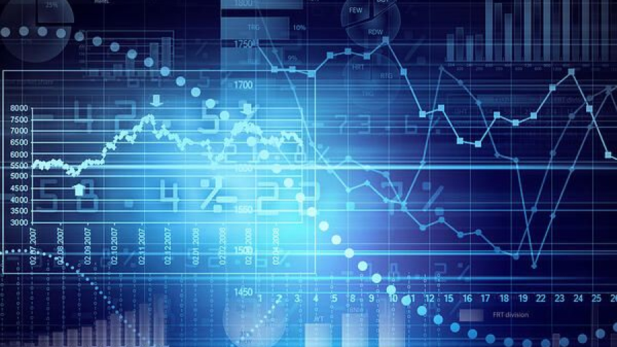 A digital graphic shows various financial charts, bar graphs, and fluctuating line graphs over a dark blue background, representing data analysis and market trends.