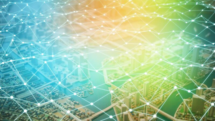 A cityscape seen from above is overlaid with a glowing, interconnected network of lines and nodes, symbolizing digital connectivity, smart city technology, and the seamless integration of the retail supply chain.