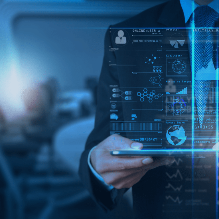 A person in a suit uses a tablet with virtual data graphics and charts overlaying the screen, representing modern business technology and data analysis in an office setting.