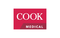 The image shows the Cook Medical logo, featuring the word COOK in large white letters and MEDICAL in smaller white letters on a red rectangular background, representing expertise that complements manufacturing consulting services.