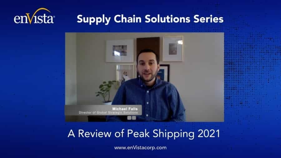 A man sits in front of a computer with a blue background that reads: Supply Chain Solutions Series. A Review of Peak Shipping 2021. His name and title, Michael Falls, Director of Global Strategic Solutions, are displayed on screen.