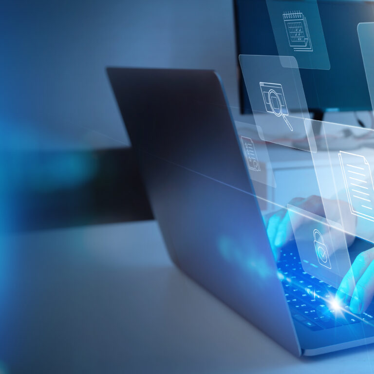 A person types on a laptop with floating digital icons, such as folders and documents, representing cloud computing and data management concepts in a modern, technology-filled environment.