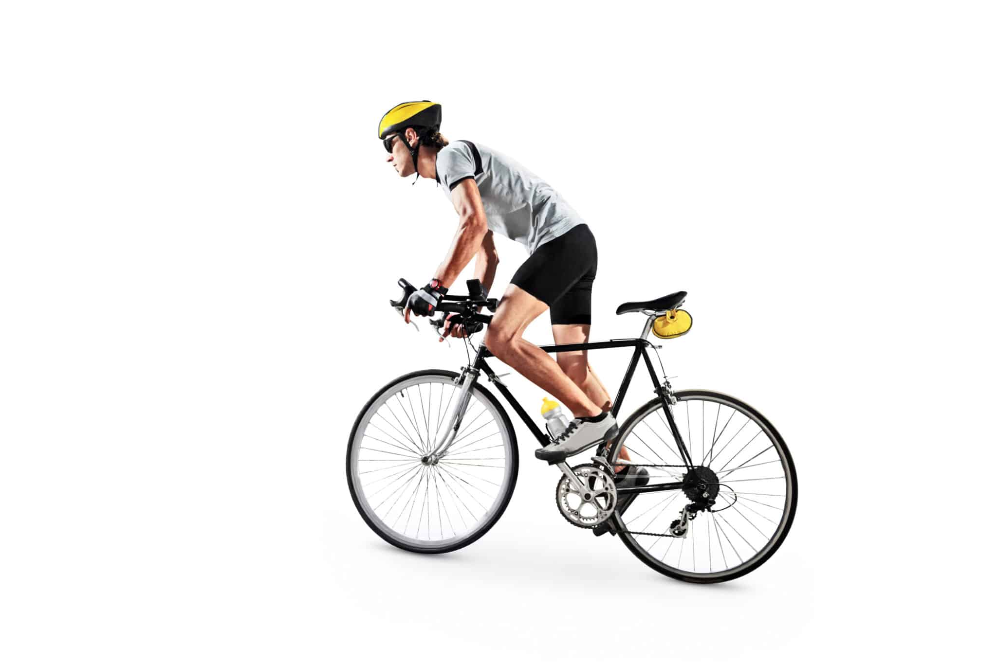 A cyclist wearing a yellow helmet, gray shirt, and black shorts rides a road bike with drop handlebars and yellow accessories, ready to navigate the city like Manhattan WMS streamlines warehouse logistics, all against a white background.