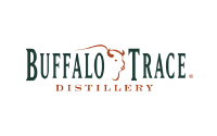 Buffalo Trace Distillery logo with the words Buffalo Trace in dark green and Distillery in orange below, featuring an outline of a buffalos head above the text.