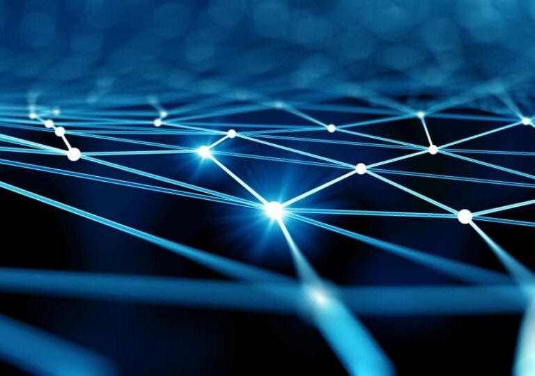 A digital abstract image showing interconnected glowing blue lines and white nodes on a dark background, representing a network or data connections.