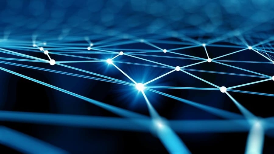 A digital abstract image showing interconnected glowing blue lines and white nodes on a dark background, representing a network or data connections.