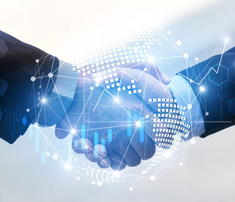 Two people in business suits shaking hands, with a digitally rendered globe and network connections overlay symbolizing global business, partnership, or technology-driven collaboration.