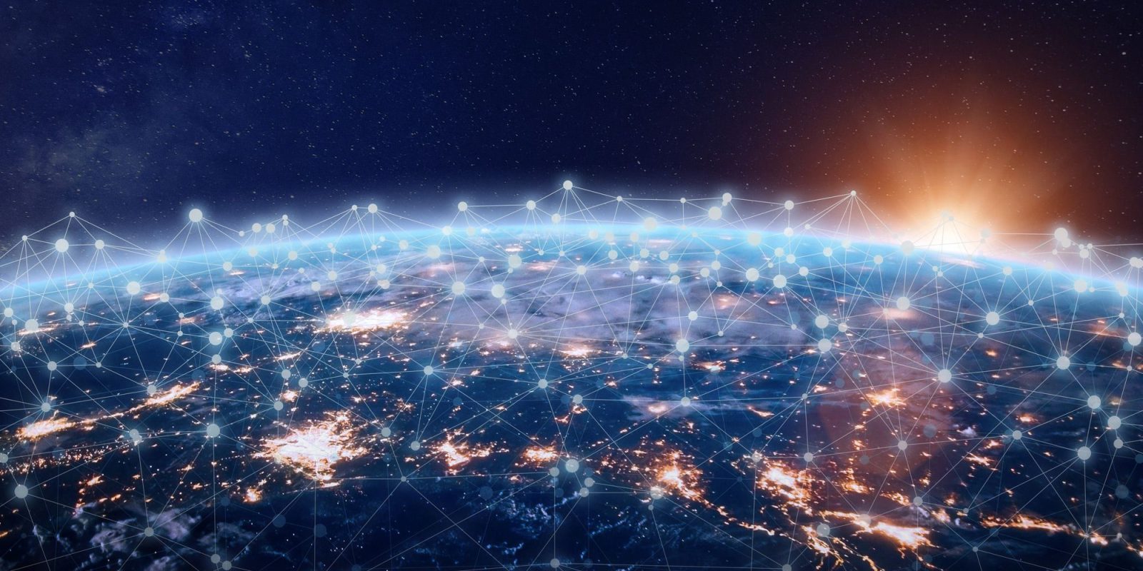 View of Earth from space at sunrise, showing bright city lights and a network of connected points and lines across the surface, symbolizing global communication and connectivity.