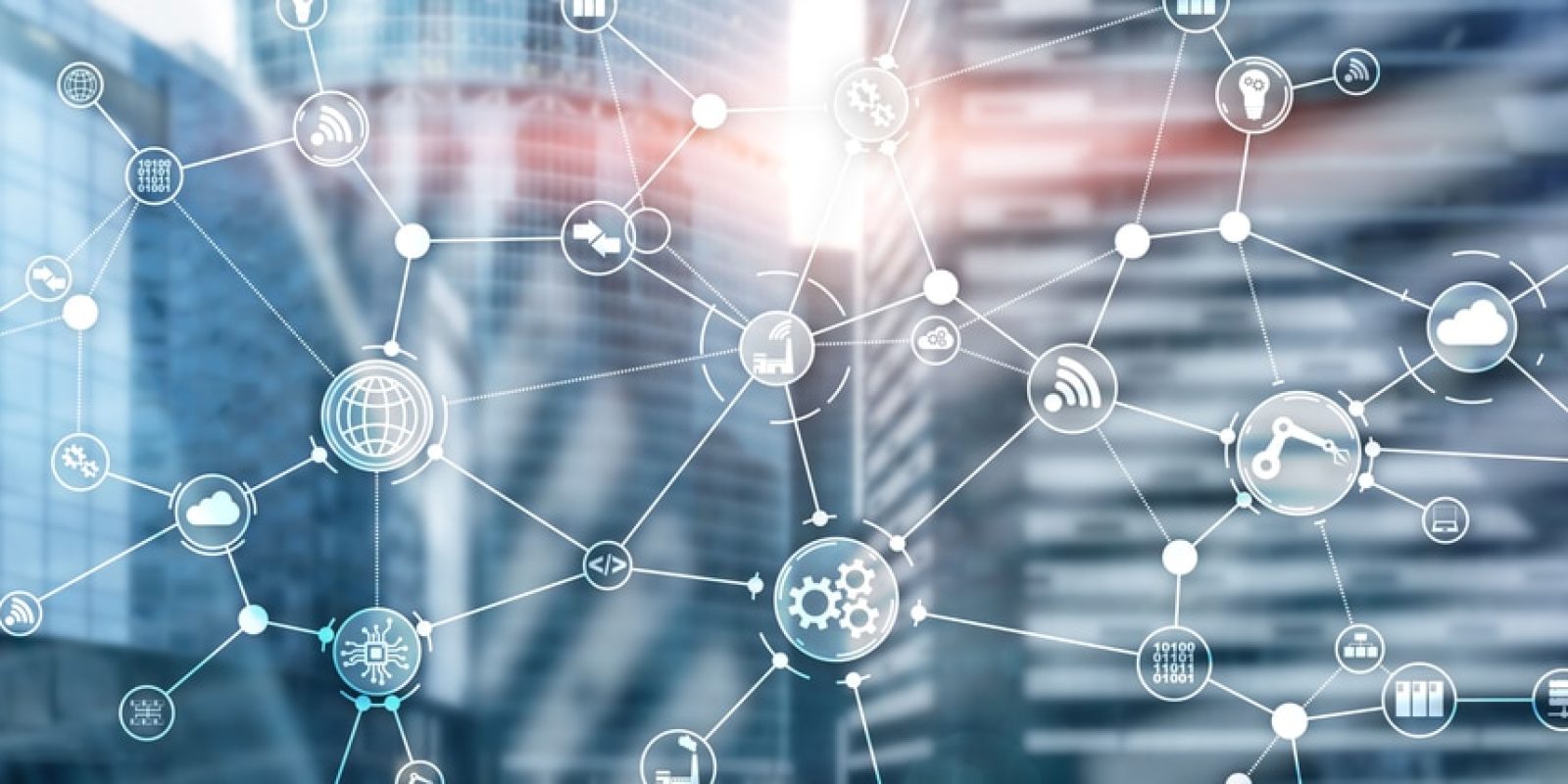 Network of interconnected digital icons representing various technologies and industries, overlaid on a blurred modern glass office building background, symbolizing connectivity, planning strategy, and smart city concepts.