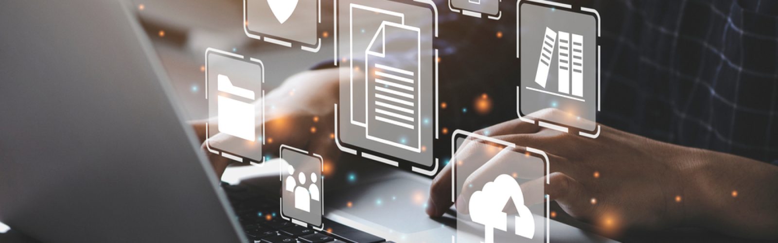 A person types on a laptop with digital icons floating above the keyboard, including symbols for security, Microsoft application management, cloud storage, folders, and documents, representing online data management and cybersecurity.