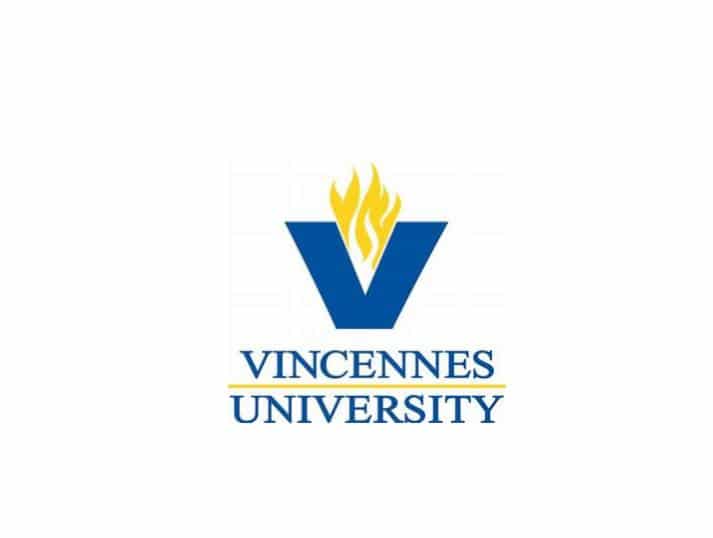 Logo of Vincennes University, featuring a large blue V with a yellow flame above it, and the university name VINCENNES UNIVERSITY in blue text below, separated by a yellow line.