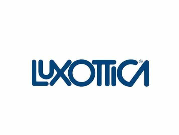 Blue Luxottica logo with stylized, rounded letters on a white background.