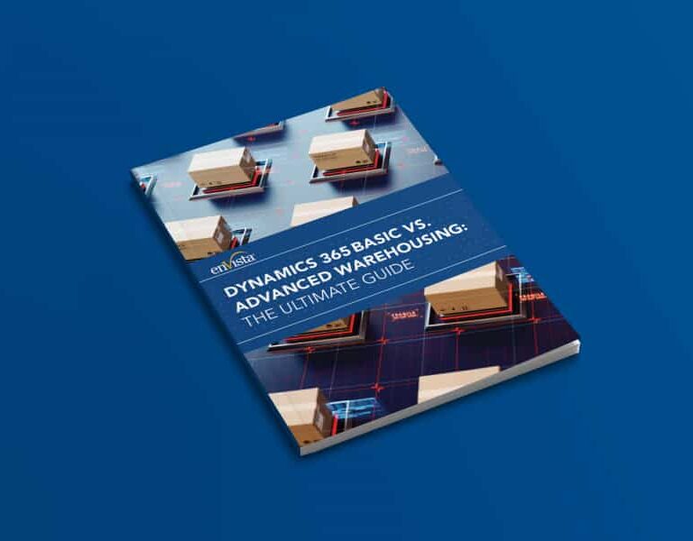 A book titled Dynamics 365 Basic vs. Advanced Warehousing: The Ultimate Guide lies on a blue surface, featuring images of shipping boxes and warehouse graphics on its cover.