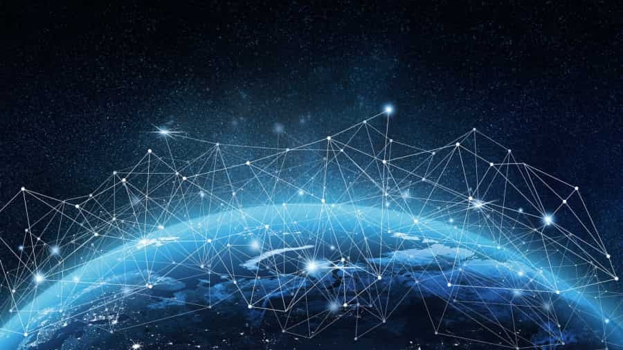 View of Earth from space with a network of glowing lines and points connecting across the surface, symbolizing global digital connectivity and data exchange on a dark, starry background.