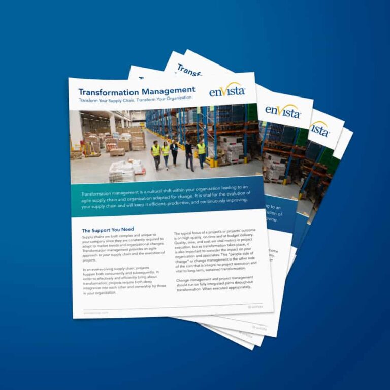 A stack of brochures titled Transformation Management with a photo of five people in safety vests walking in a warehouse, surrounded by shelves and boxes. The brochures feature the enVista logo and text about supply chain transformation.