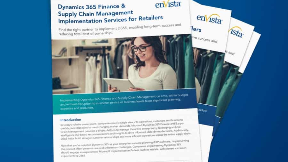 A stack of informational brochures titled Dynamics 365 Finance & Supply Chain Management Implementation Services for Retailers on a blue background, featuring a woman working on a laptop and clothing racks in the background.