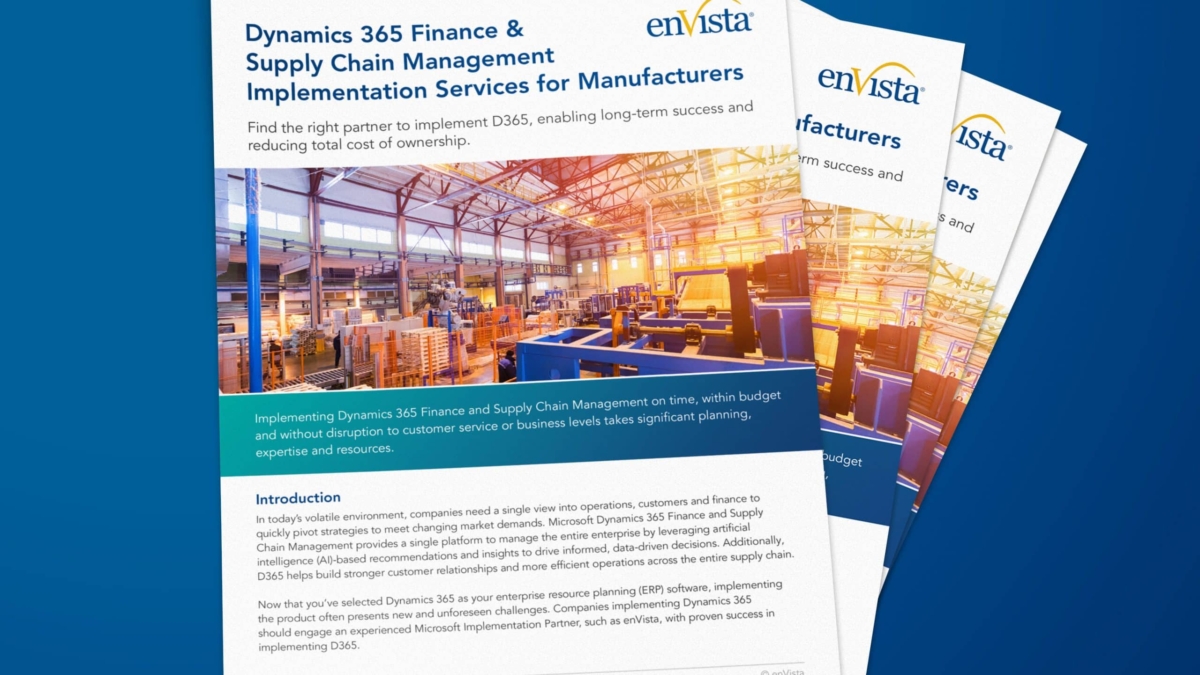 A stack of brochures titled Dynamics 365 Finance & Supply Chain Management Implementation Services for Manufacturers by enVista, featuring an image of a warehouse with shelves and boxes on the cover.