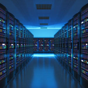 A brightly lit data center with rows of server racks on both sides, filled with colorful blinking lights and a reflective floor, showcases a modern, high-tech atmosphere ideal for cloud managed services.