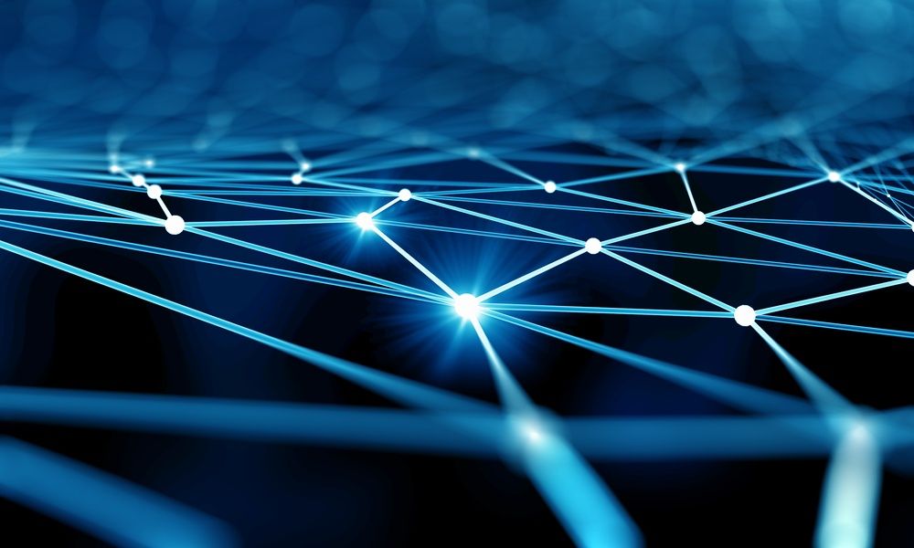 Abstract digital image of interconnected glowing blue lines and points forming a network on a dark background, representing data connections or a neural network.