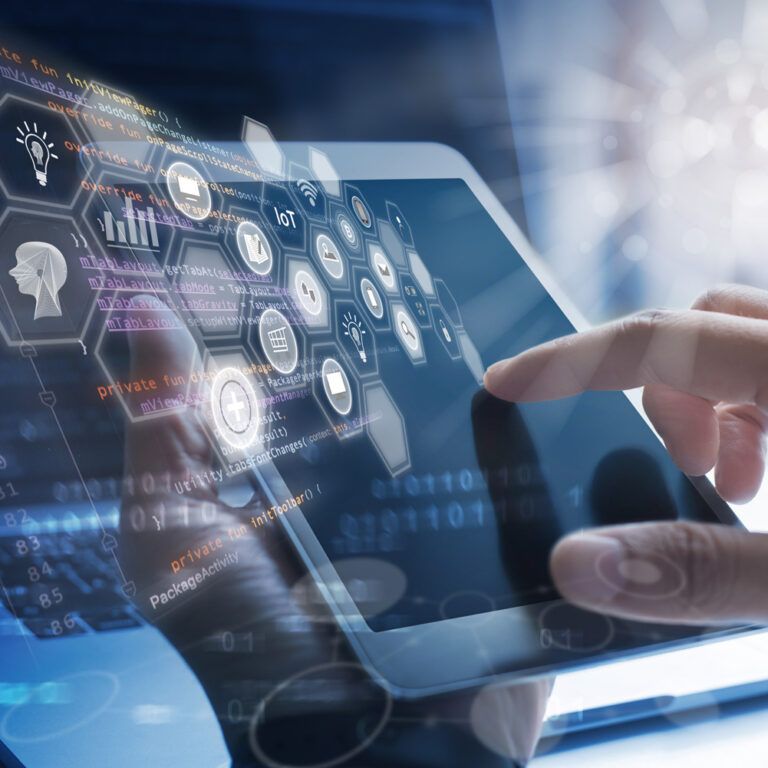 A person interacts with a tablet displaying digital icons and data graphics, with a futuristic interface overlay representing technology, cloud computing, and artificial intelligence concepts.