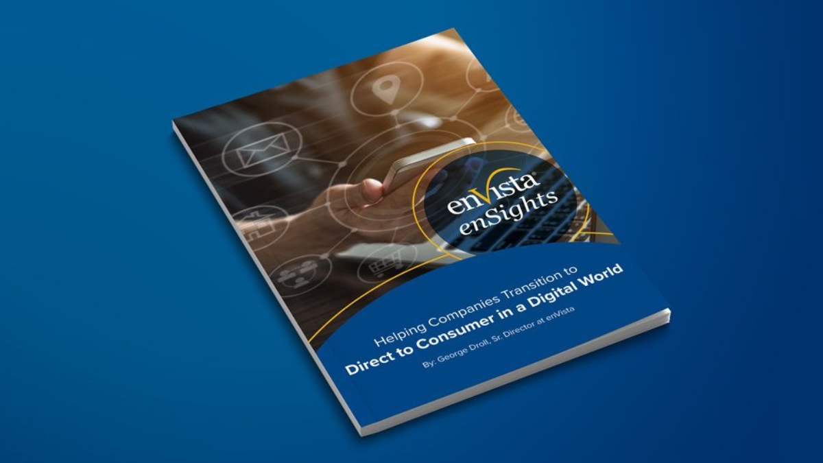 A booklet titled enVista enSights: Helping Companies Transition to Direct-to-Consumer in a Digital World lies on a blue surface, displaying digital icons and a hand interacting with a tablet on its cover.