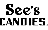 Logo for See’s Candies featuring the brand name in bold, black letters on a white background. See’s is written in a playful, rounded font above CANDIES in a blocky, all-caps style.