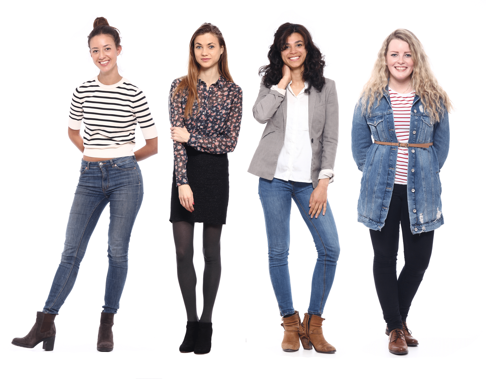 Four women associate side by side against a white background, each in casual outfits—jeans, skirts, boots, sweaters, and jackets—all smiling and posing for the camera.