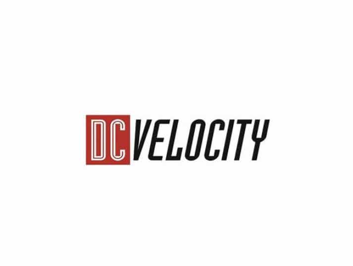 The DC Velocity logo features the letters DC in white on a red square, followed by the word VELOCITY in bold, black, italicized capital letters on a white background.