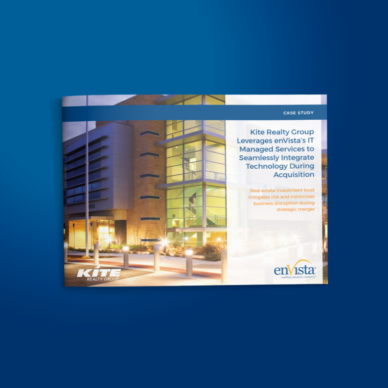 Case study cover showing a modern office building at night with illuminated windows. The text highlights Kite Realty Group utilizing enVistas IT services for integrating technology during an acquisition.