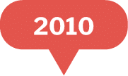 A red speech bubble with the year 2010 written in bold white text in the center.