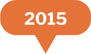 An orange speech bubble with the year 2015 written in bold white text at the center.