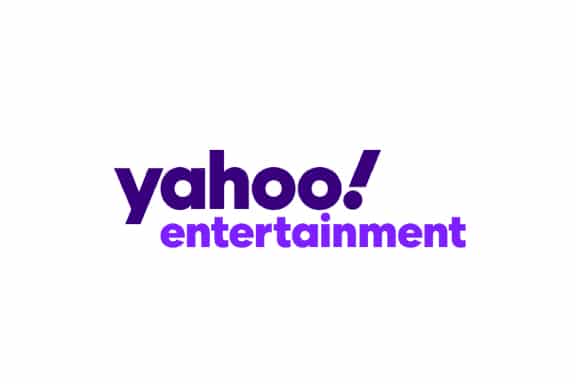 The image shows the Yahoo Entertainment logo with yahoo! in bold dark purple letters and entertainment in a lighter purple below it, all on a white background.