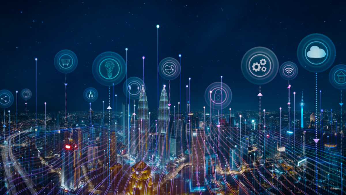 A futuristic city skyline at night with digital icons representing technology concepts, such as cloud computing, security, smart home, and automation, connected by glowing lines and dots above the buildings.
