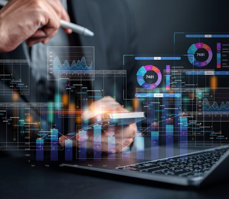 A person using a smartphone and laptop, surrounded by virtual financial charts, graphs, and data visualizations, representing digital financial analysis and investment in a modern, technology-driven environment.