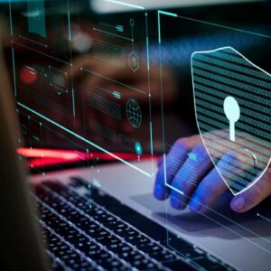 A person using a laptop with digital graphics overlaying the screen, including a large shield with a keyhole symbol, highlights cybersecurity and the cost of a security breach in protecting sensitive data.