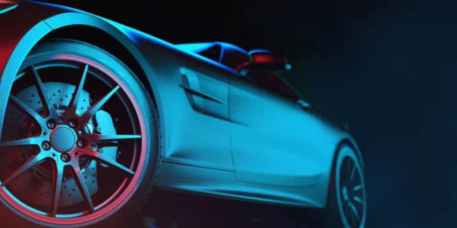 Close-up, low-angle view of a sleek, modern sports car with dramatic blue and red lighting highlighting the rear wheel, brake discs, and smooth side body—an image embodying the precision of advanced automation strategies against a dark background.