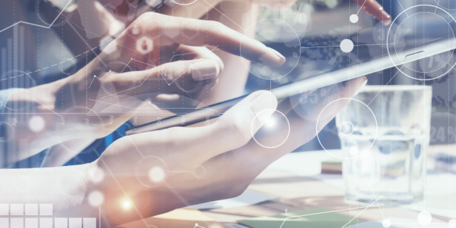 Two people use digital tablets at a desk with documents and a glass of water. Abstract technology and data icons overlay the image, symbolizing innovation, teamwork, and digital collaboration in a modern workspace.