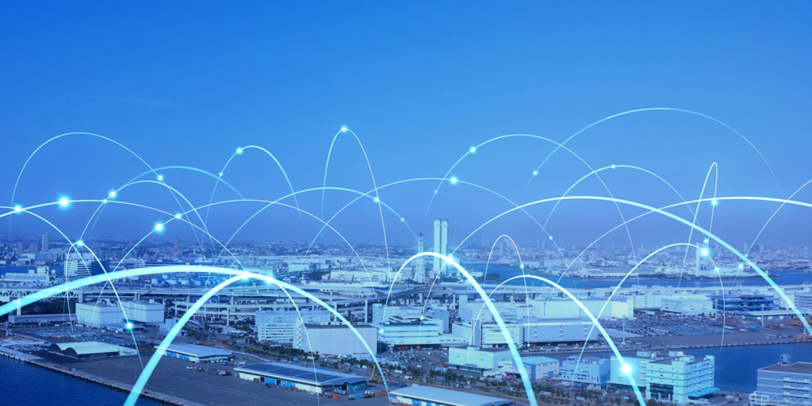 A cityscape with a harbor, overlaid with glowing blue arcs representing digital connections or data networks, illustrating the concept of smart cities or modern connectivity.