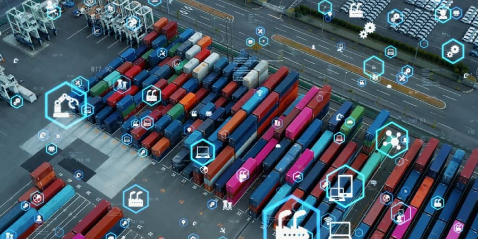 Aerial view of a shipping container yard with colored containers and overlayed digital icons representing technology, automation, and connectivity in logistics and supply chain management.