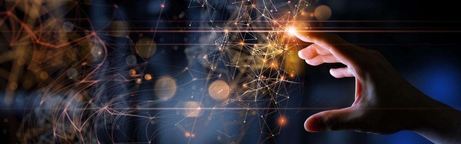A hand reaches toward glowing, interconnected digital nodes and lines, symbolizing innovation, technology, and networking—echoing what is Microsoft Dynamics 365—against a dark, blurred background with orange light effects.